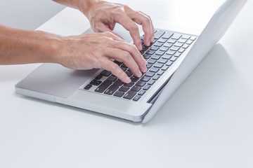 Man hands typing laptop keyboard