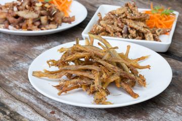 Sardines being prepared with sea salt