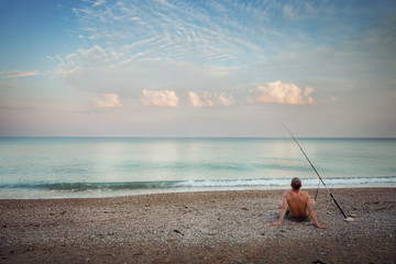 A fisherman on the beach in the morning © Aleksey Sagitov