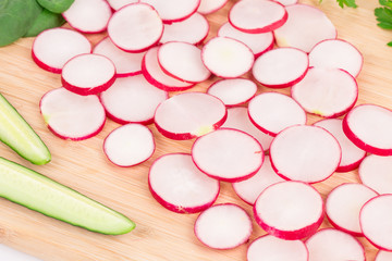 Sliced vegetables as a background.