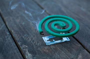 Mosquito coil on the wood