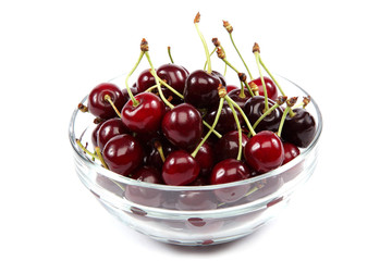 Fresh cherries in a glass dish.