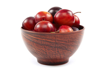 Fresh plums on white background.