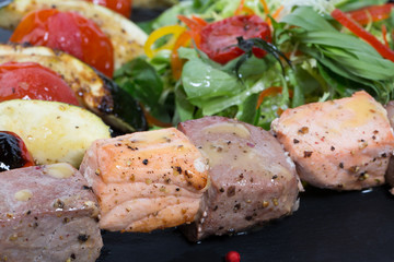 grilled fish and vegetables with salad