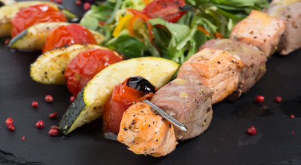 grilled fish and vegetables with salad