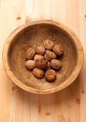 Walnuts in old wooden bowl