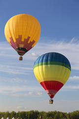 Flying balloons in blue sky