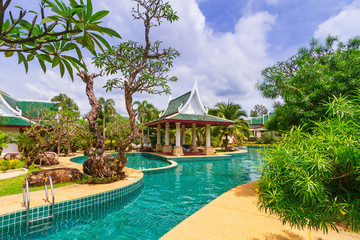 Tropical holidays at swimming pool in Thailand