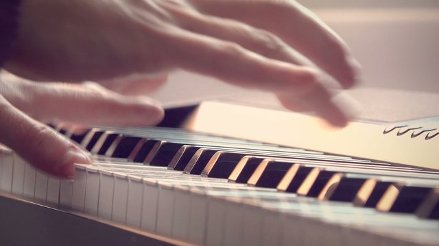 a man playing the piano, 4K