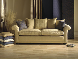 cream sofa in modern living room with cushions