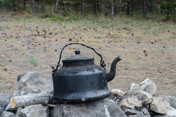 sooty kettle on the fire