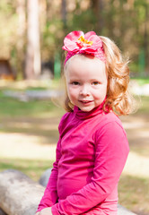 Portrait of little girl in forest