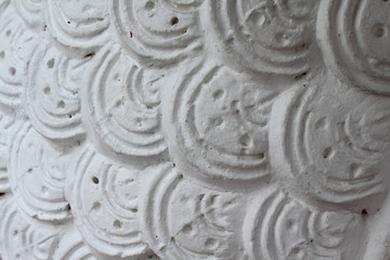 Closeup of concrete naga snake skin.