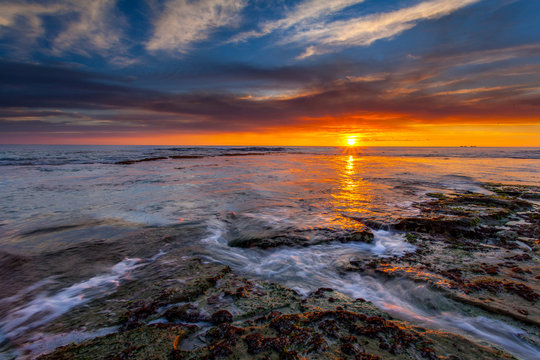 beautiful sunset beach rock