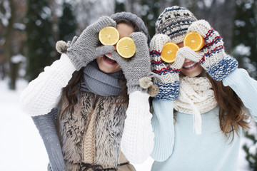 Funny girls with natural vitamins in winter