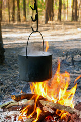 Tourist kettle over camp fire