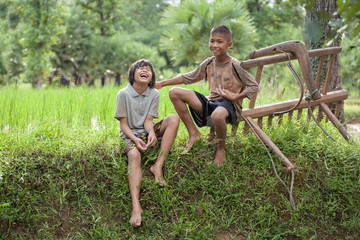 Fototapeta premium Little boy and girl farmer on green fields.