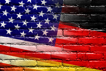 USA and Germany Flag painted on brick wall
