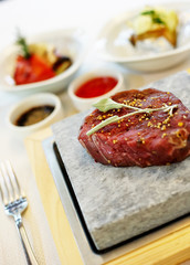 Steak cooked on stone
