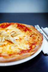 Stone baked pizza margherita with artichoke