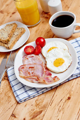 Breakfast with fried eggs and bacon