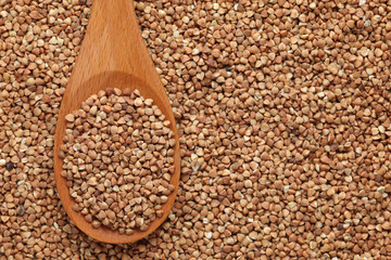 Buckwheat in a wooden spoon
