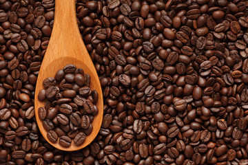 Coffee beans in a wooden spoon