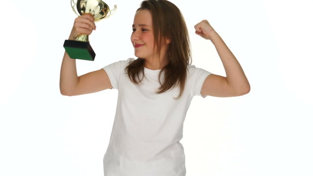 Happy young girl with a sports trophy
