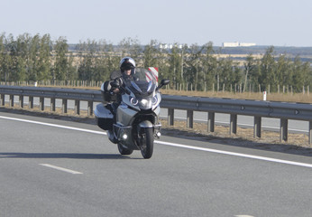 Obraz premium Motociklist goes on speedway