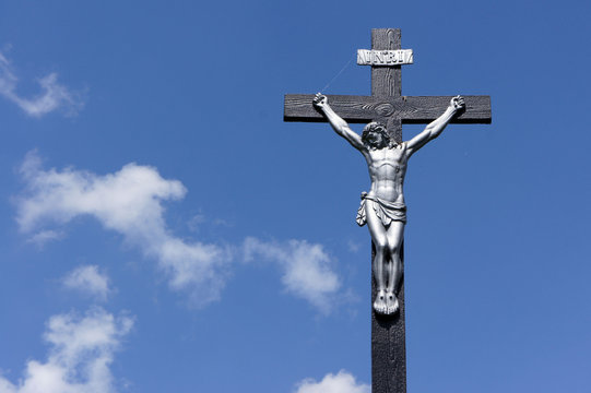 Jesus on the cross against a blue sky