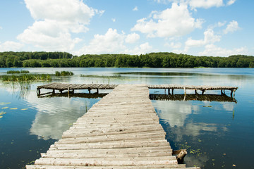 Bridge over a lake in the woods © bzyxx