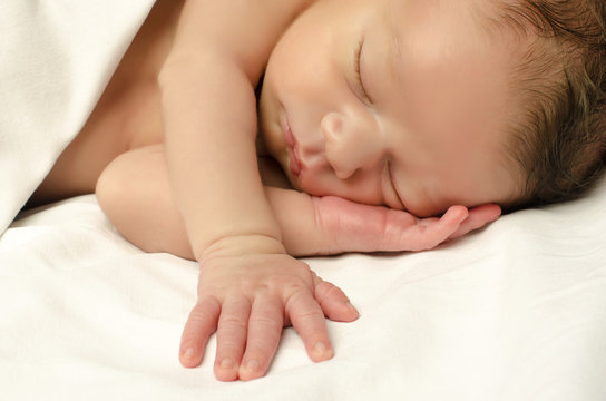 Beautiful innocent newborn sleeping. Adorable little boy 