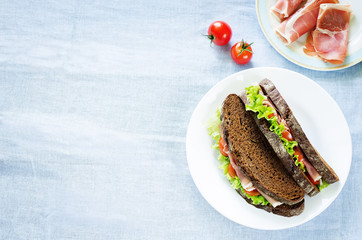 sandwich with rye bread and prosciutto © nata_vkusidey