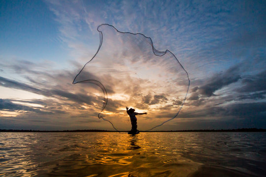 Fishermen fishing by fishnet
