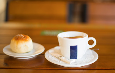 Coffee Cup and Bread Roll. Continental Breakfast.
