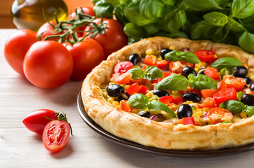 Pizza on wooden table