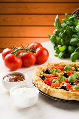 Pizza on wooden table