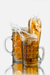 splash beer in glasses - 69396937