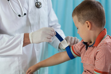 Little boy before taking blood sample
