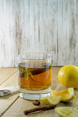 Cup of Healthy Tea over wood background
