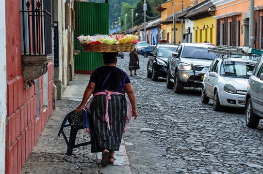 Traditional woman selling fruits in Antigua, Guatemala