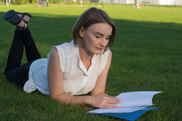 girl in the park with documents