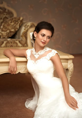 Beautiful bride with stylish make-up in white dress