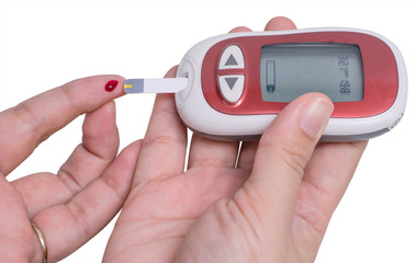 Female hand testing for high blood sugar on white background