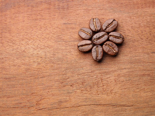 Coffee crop beans with text paper on wood texture