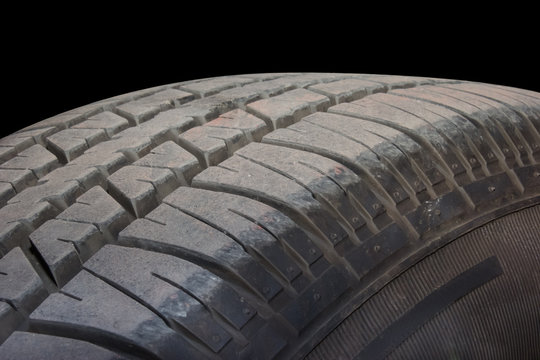 Close up of tire on black background