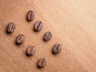 Coffee crop beans on wood texture