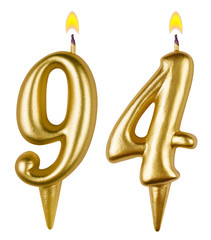 Birthday candles number ninety four isolated on white background
