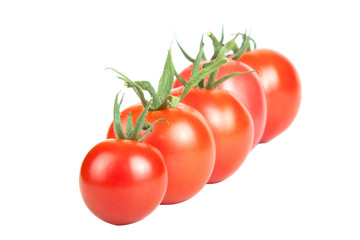 tomatoes constructed in a row isolated on white background