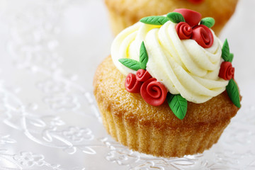 Wedding reception cupcakes decorated with sugarcraft red roses